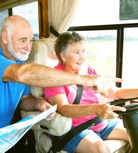 Elderly couple driving campervan with Kiwi Fuelcard